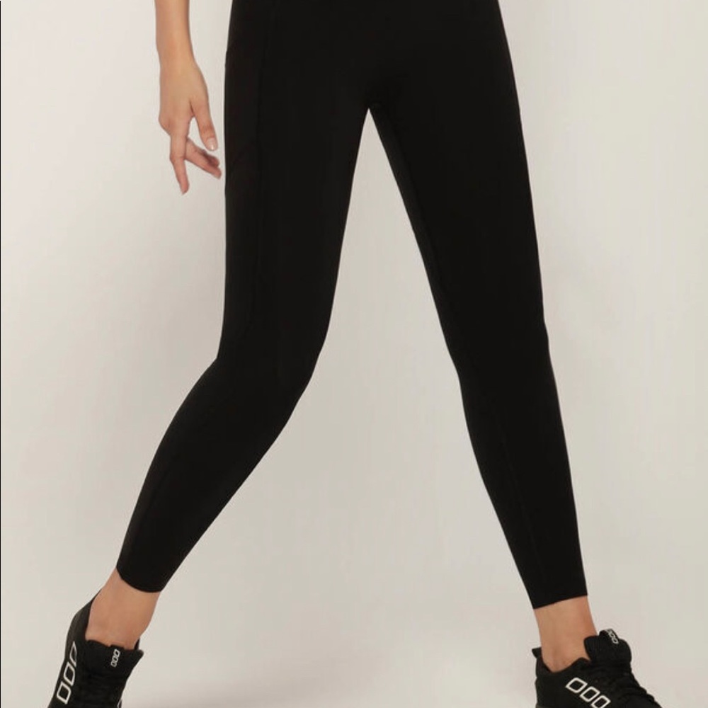 Lorna Jane Black Leggings with mesh at the bottom.